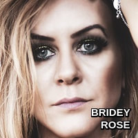 Bridey Rose.
Impassioned raw poetic songs , soaring vocals and upbeat rythmic guitar.