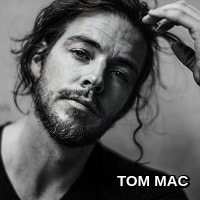 Tom Mac.  Nomadic singer-songwriter with meaningful tunes.